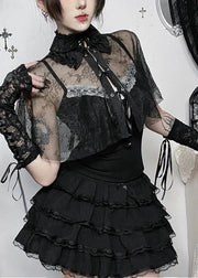 Person wearing a black lace outfit with a white background