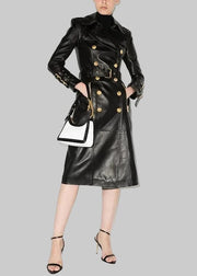 Woman wearing a black leather coat with gold buttons on a white background, featuring the BluWin brand.