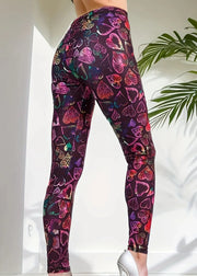 Colorful heart-patterned leggings worn by a person on a white background