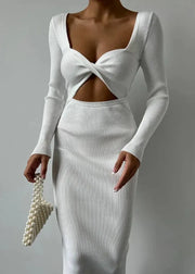 White ribbed knit dress with cut-out design on a gray background