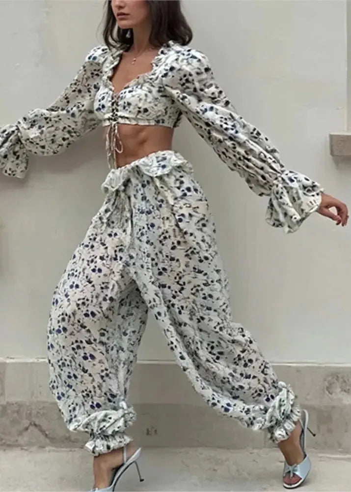 Woman wearing a floral outfit with a neutral background