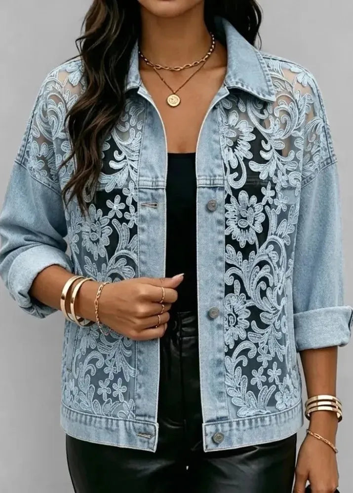 Denim jacket with lace detailing worn by a person on a gray background