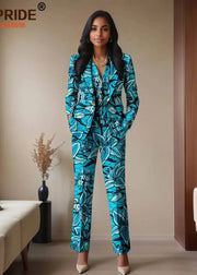 Woman wearing a blue floral jumpsuit in a room with beige walls and a couch.