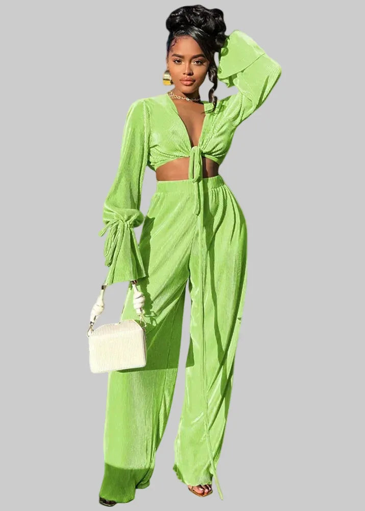 Woman wearing a green outfit with 'Wmstar' branding in a bright room.
