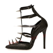 A single black high-heeled shoe with a pointed toe, stiletto heel, and multiple wraparound ankle straps topped with metal spikes. The shoe has a crocodile-embossed texture and is photographed on a plain white background.