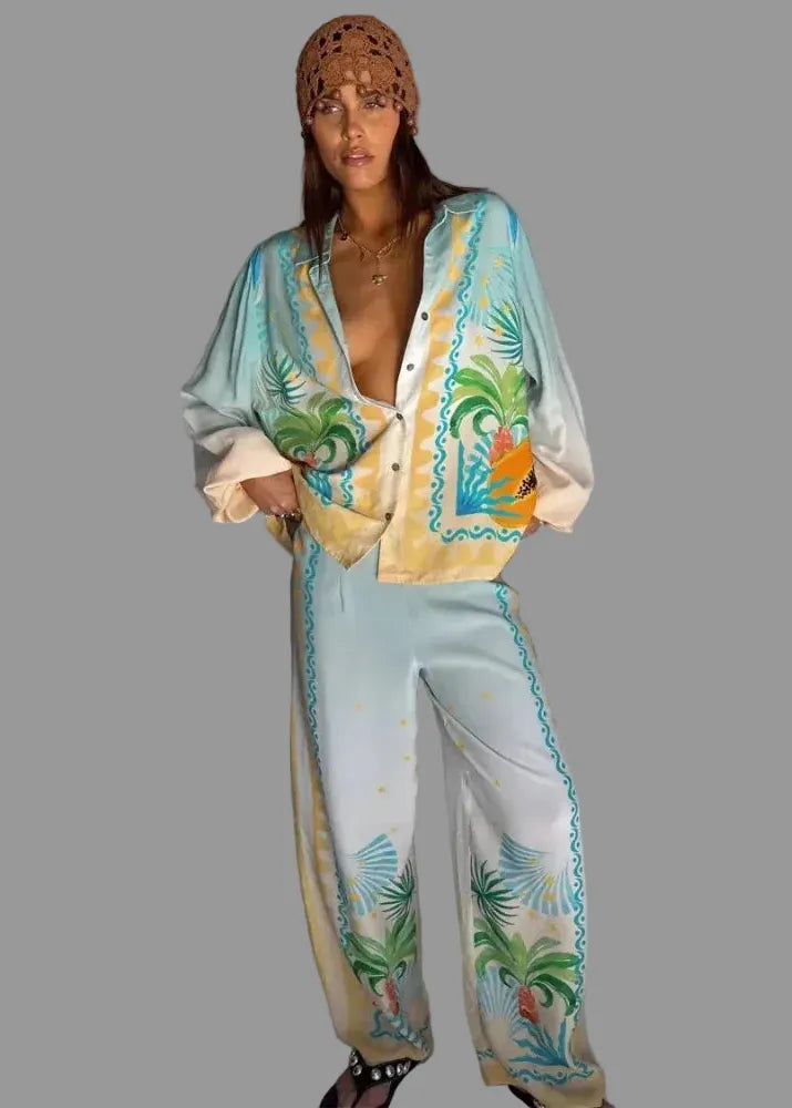 Woman wearing a colorful outfit with floral patterns on a plain background
