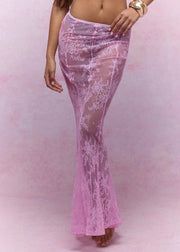 Pink lace skirt worn by a person on a pink background