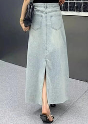 Long denim skirt with a front slit worn by a person on a neutral background