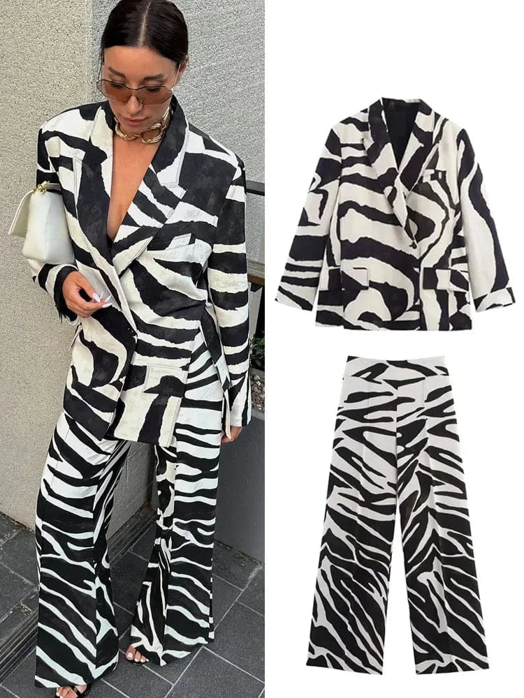 Woman wearing a zebra print outfit with 'Trafza' branding.