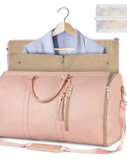 Pink duffel bag with clothes on a hanger and a clear pouch on a white background