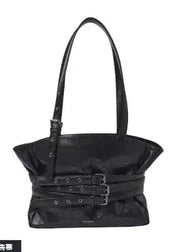 Black handbag with decorative straps on a white background